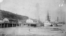 Boats at Northern Pacific dock with Blackwell Hotel, Tacoma, Washington Territory, circa 1885
